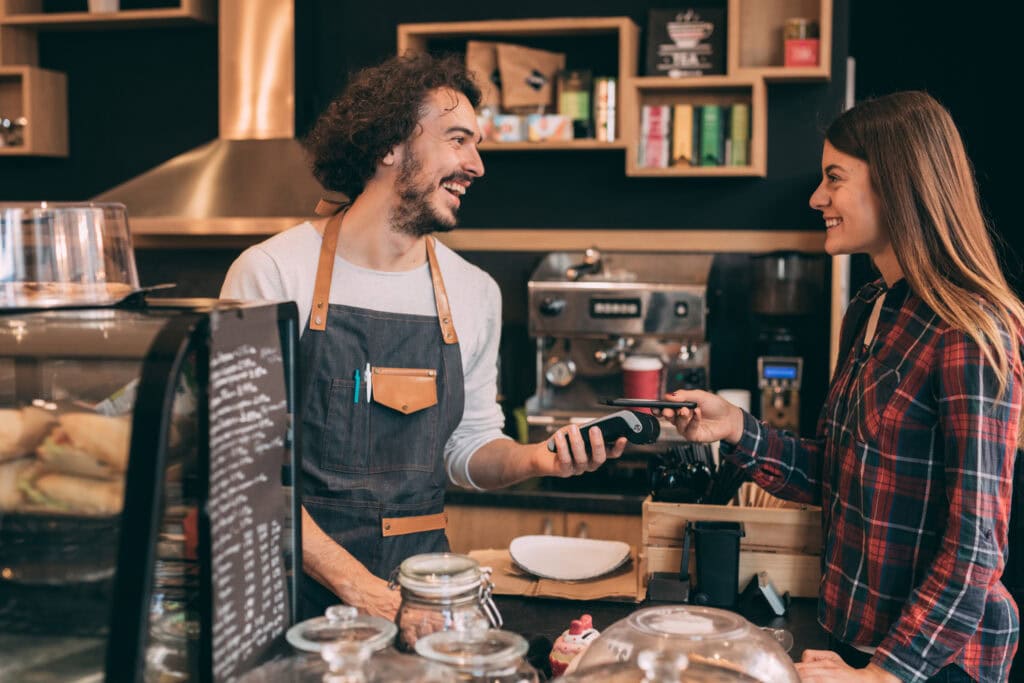 Kapitan's Able Men Merchant and Customer with Credit Card Machine